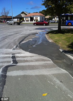Liquefaction is seen seeping out of the ground
